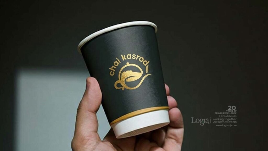 Chai Kasarod tea brand logo designed by Logoraj, displayed on a shop wall and takeaway cup